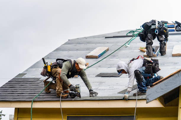 Professional Storm Damage Roof Repair technician working in Lake Milton, OH